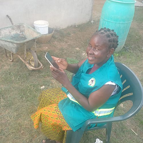 Photo of community health worker using a digital health application